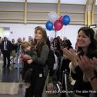 These are airport passengers at Washington Dulles Airport they are cheering away because...